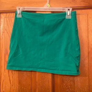Green and black body con skirts